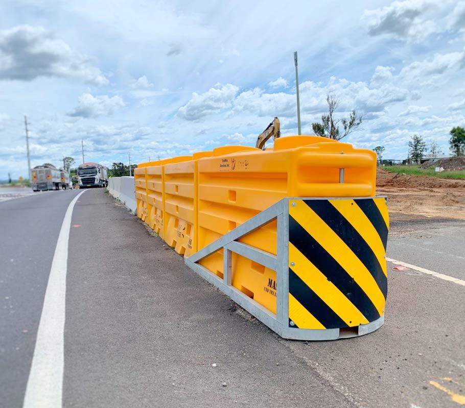 men discussing in front of barriers