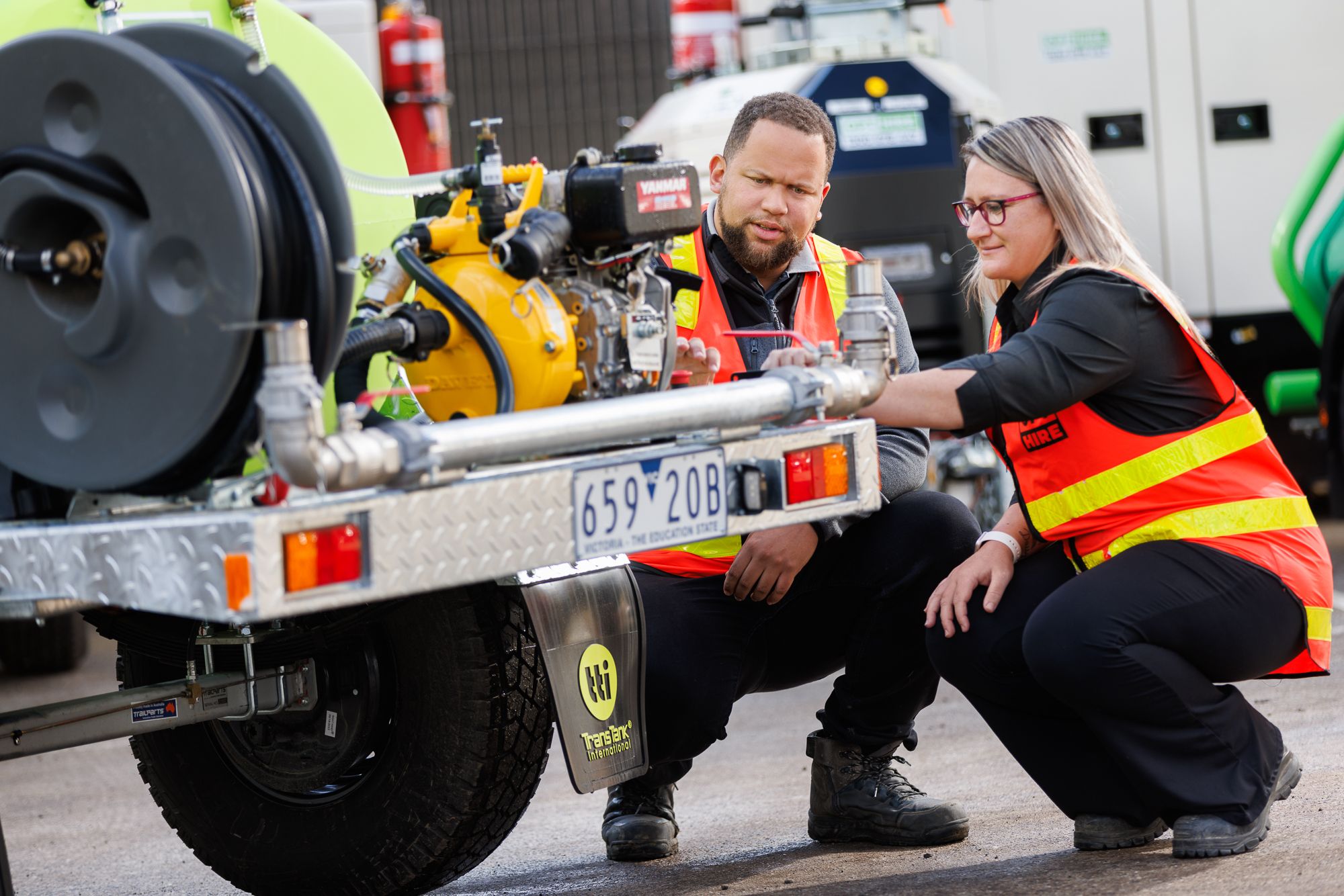 employees working on water pump