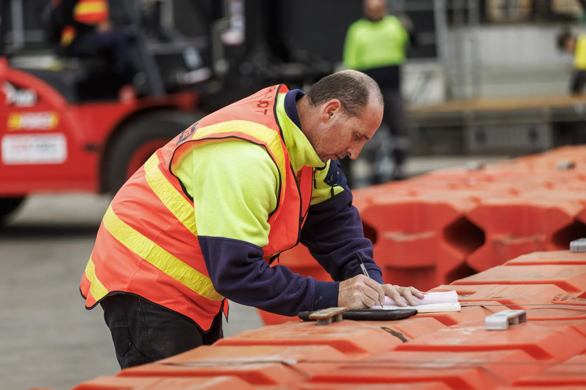 man writing on water barrier