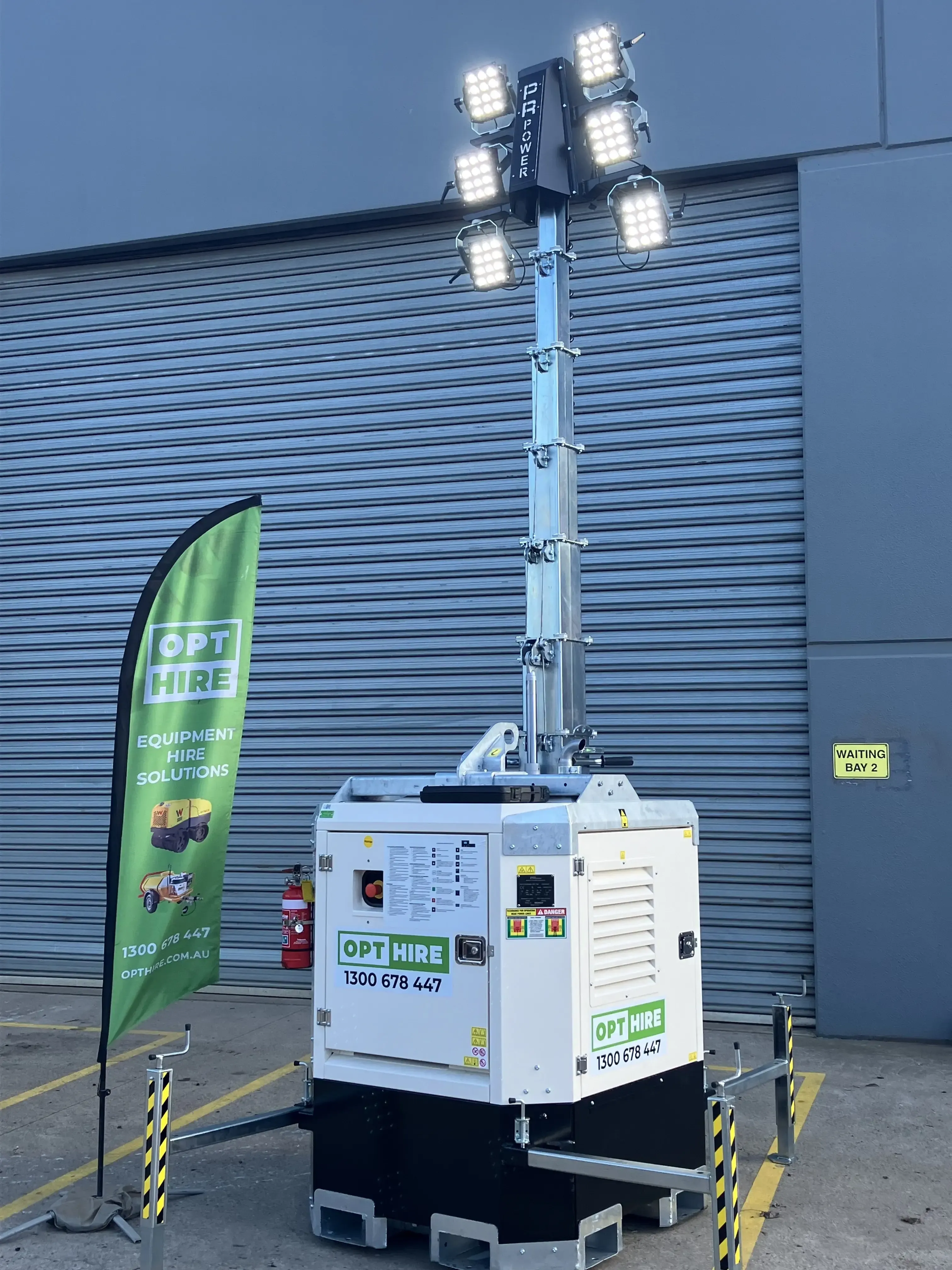 2 men standing in front of tower